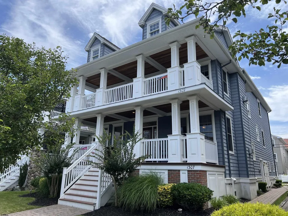 We see the front of a grey and white house in Ocean City, NJ.